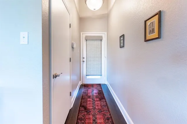 a view of a hallway with a room