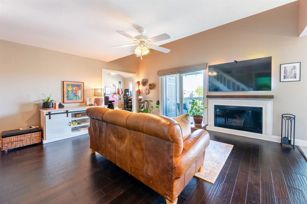 812 Signal Ridge Place Rockwall, TX 75032 - Photo 10 of 29 a living room with furniture and a fireplace