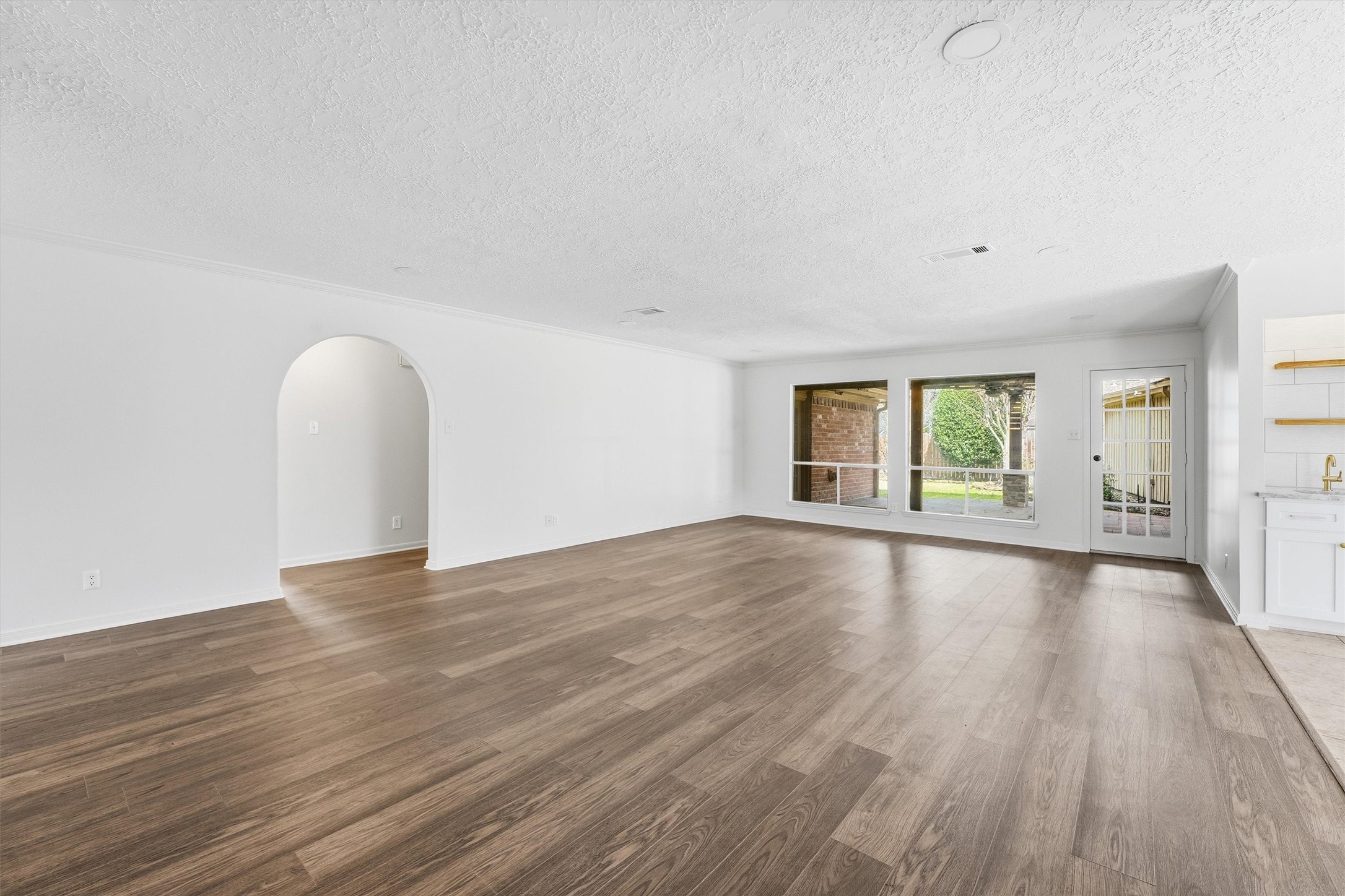 2203 Rolling Meadows Drive Houston, TX 77339 - Photo 11 of 27 a view of an empty room with wooden floor and window