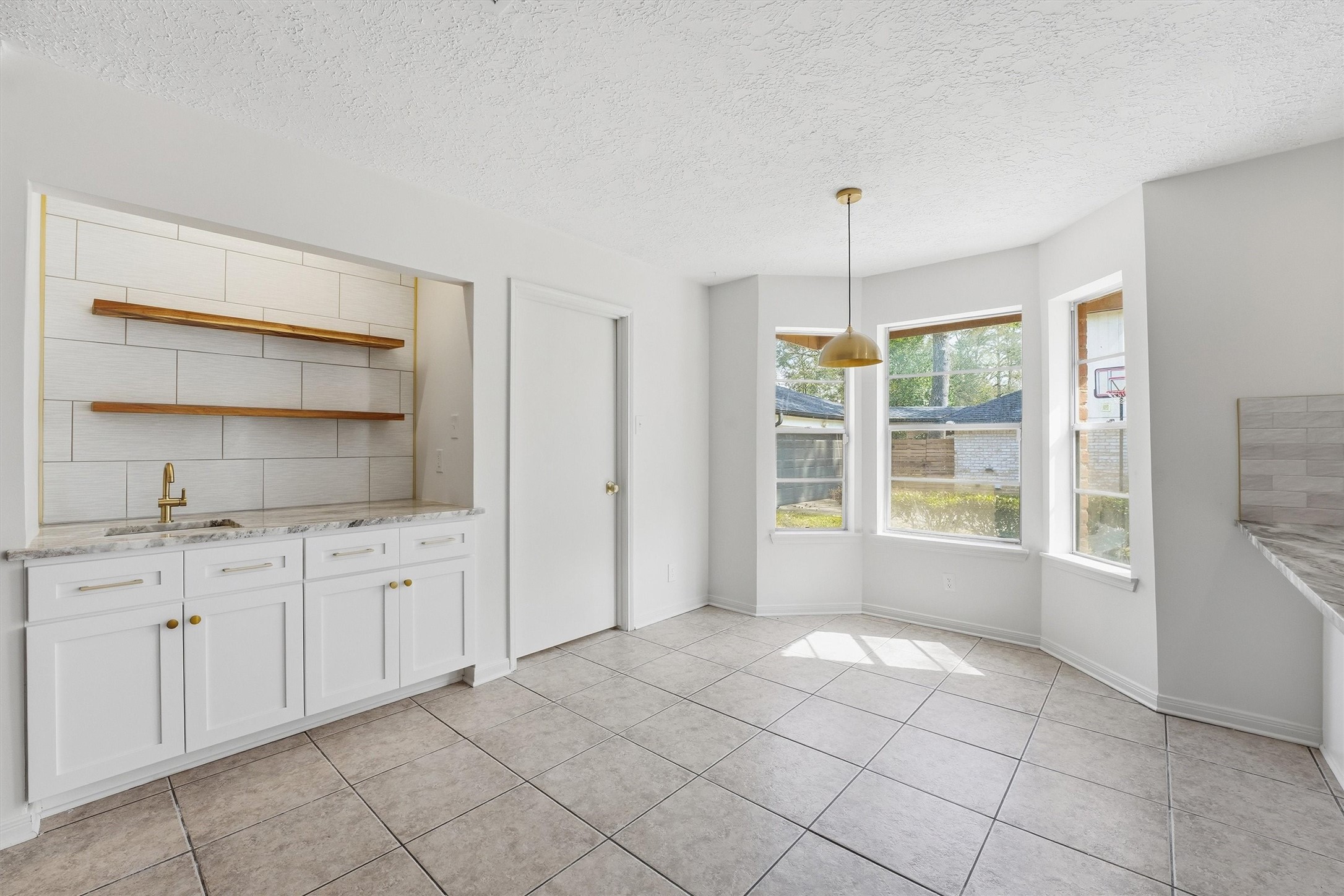 2203 Rolling Meadows Drive Houston, TX 77339 - Photo 12 of 27 a spacious bathroom with a granite countertop sink a mirror and a bathtub
