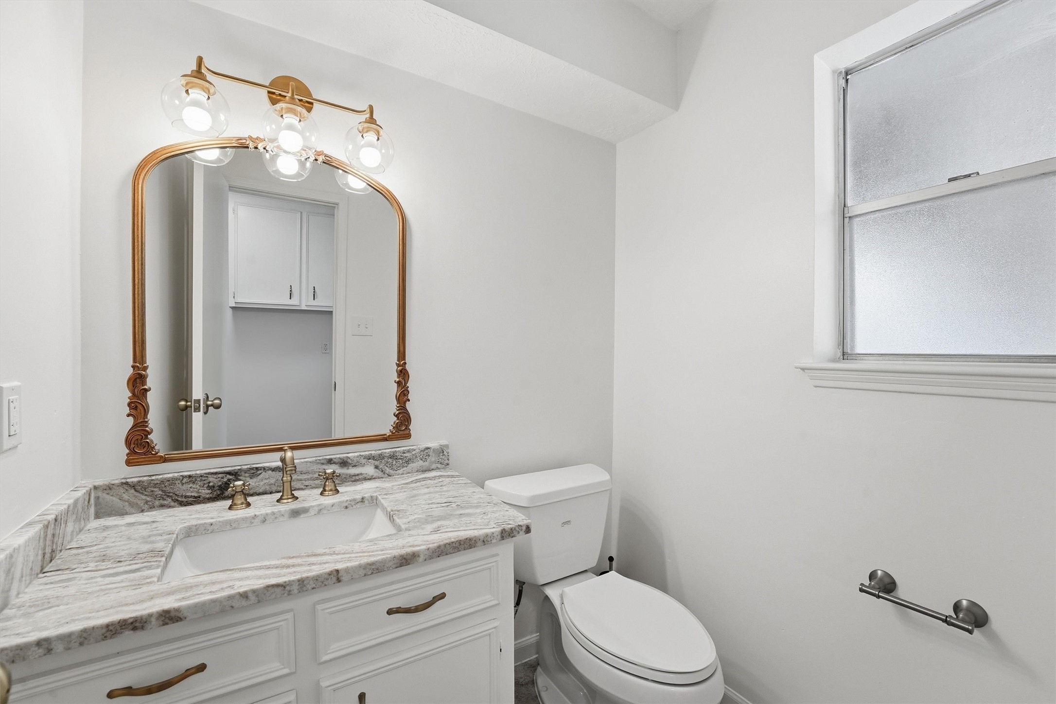 2203 Rolling Meadows Drive Houston, TX 77339 - Photo 17 of 27 a bathroom with a sink vanity mirror and toilet