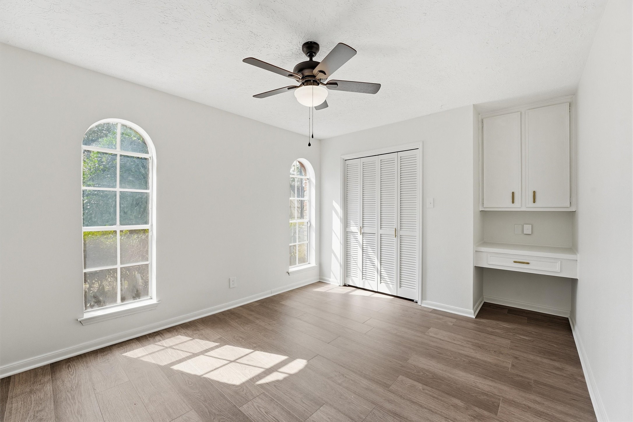2203 Rolling Meadows Drive Houston, TX 77339 - Photo 18 of 27 wooden floor in an empty room with a window