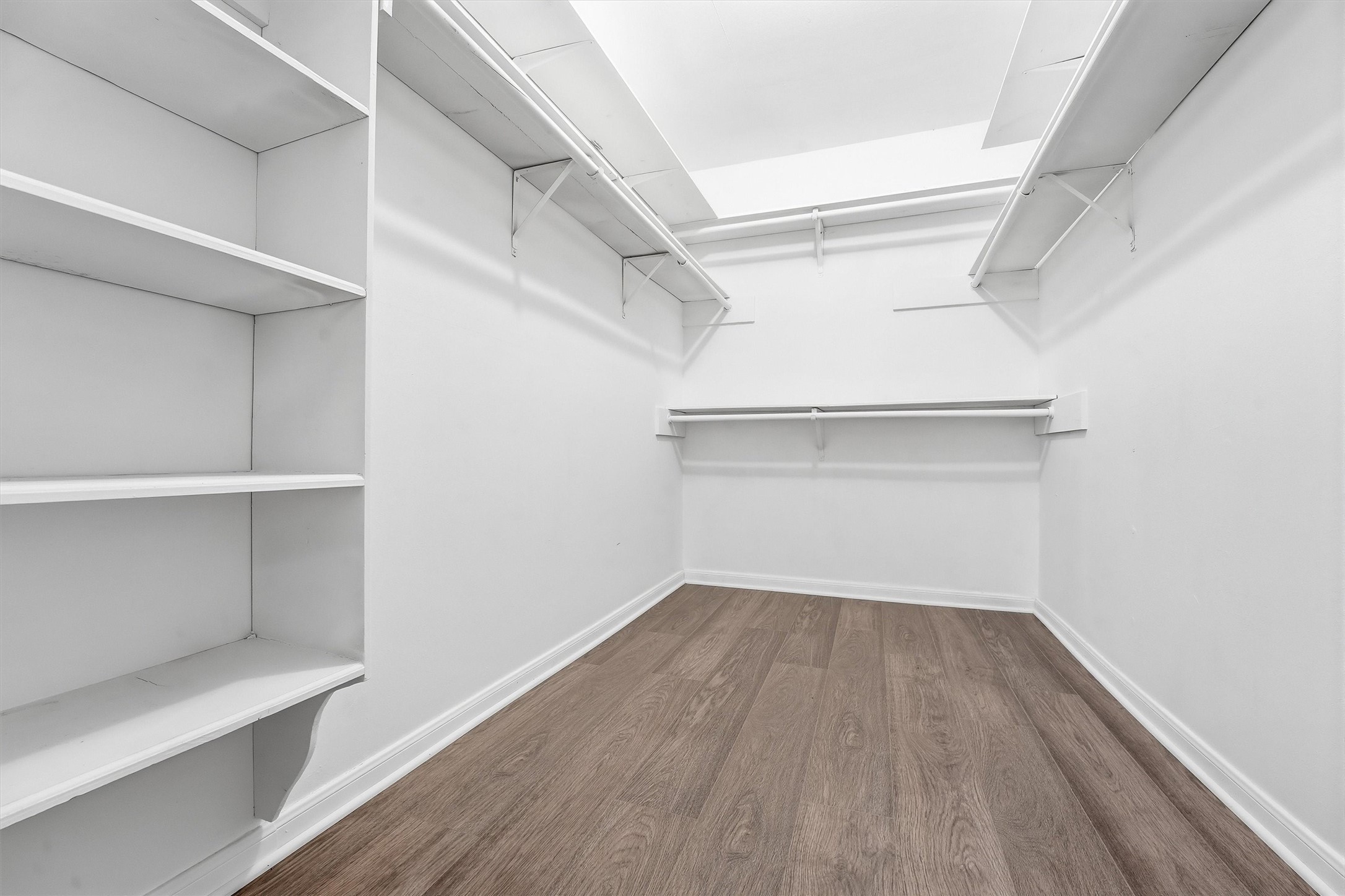 2203 Rolling Meadows Drive Houston, TX 77339 - Photo 25 of 27 a view of storage and utility room with wooden floor