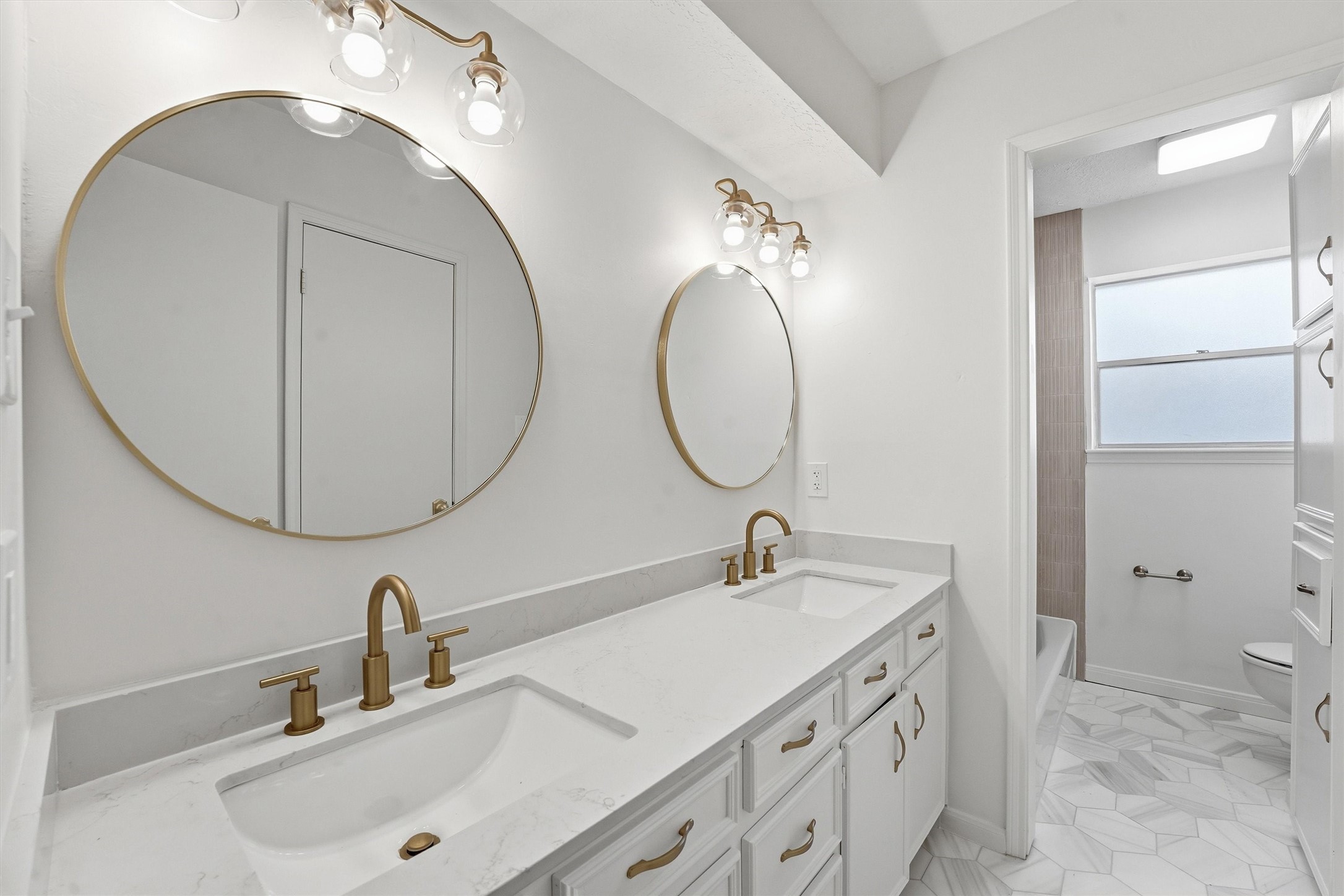 2203 Rolling Meadows Drive Houston, TX 77339 - Photo 5 of 27 a bathroom with a sink double vanity and a mirror