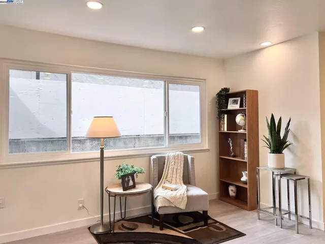 a living room with furniture and a lamp