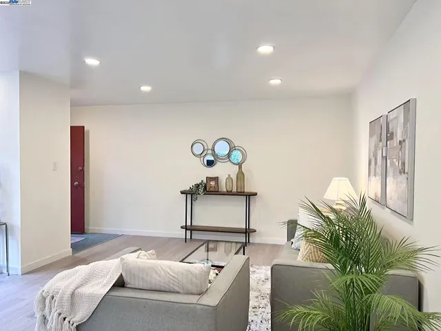 a bedroom with a bed and ceiling fan