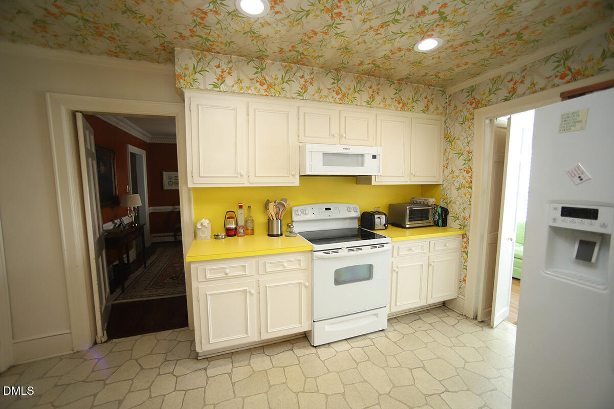 2601 York Road Raleigh, NC 27608 - Photo 7 of 24 a kitchen with cabinets appliances and a counter top space