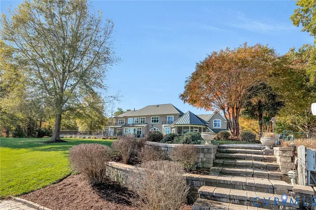 a view of outdoor space with swimming pool and lake view