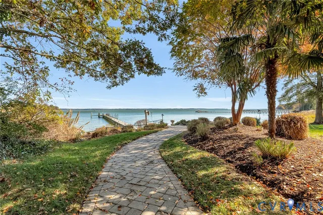 a view of a garden with wooden fence