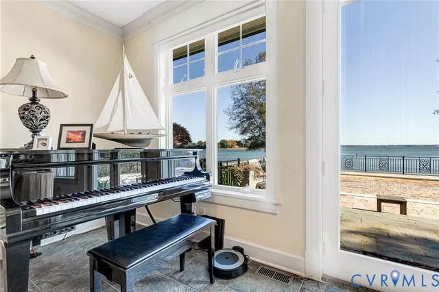 a kitchen with stainless steel appliances granite countertop a sink and a refrigerator