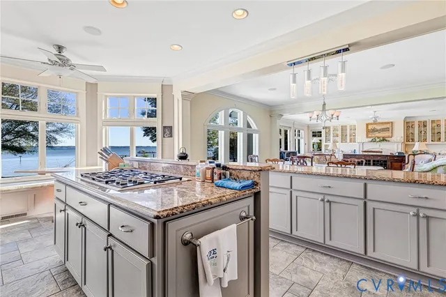 a kitchen with stainless steel appliances granite countertop a sink and stove