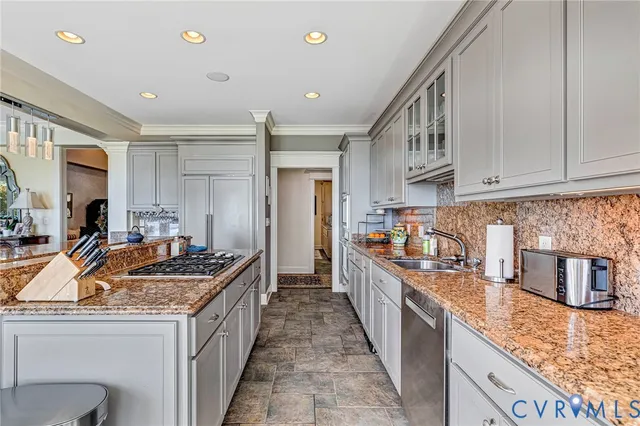 a kitchen with granite countertop cabinets and window
