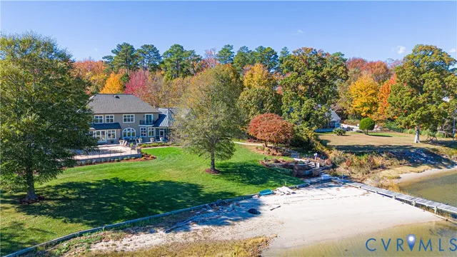 a view of a house with a yard and sitting area