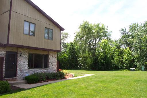 759 Bon Terre Road, Unit 759 New Lenox, IL 60451 - Photo 1 of 1 a view of a backyard with plants and a garden