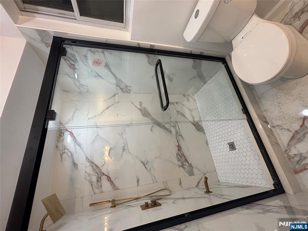 48 1/2 3rd Street Newark, NJ 07107 - Photo 17 of 20 a bathroom with a toilet and a shower