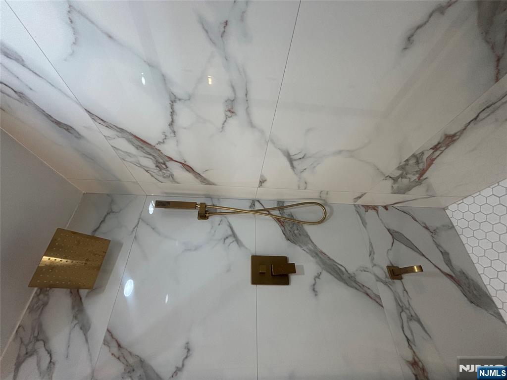 48 1/2 3rd Street Newark, NJ 07107 - Photo 20 of 20 a bathroom with a shower and a window