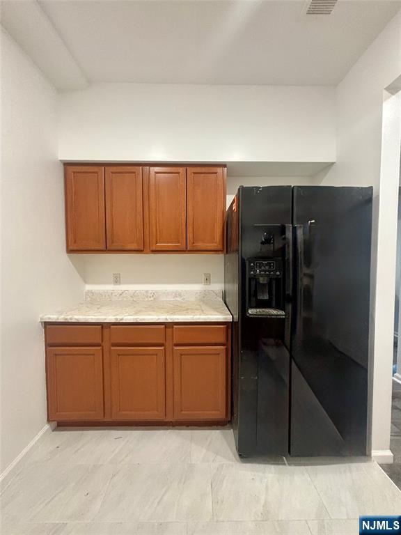 48 1/2 3rd Street Newark, NJ 07107 - Photo 3 of 20 a kitchen with stainless steel appliances granite countertop a refrigerator and a stove