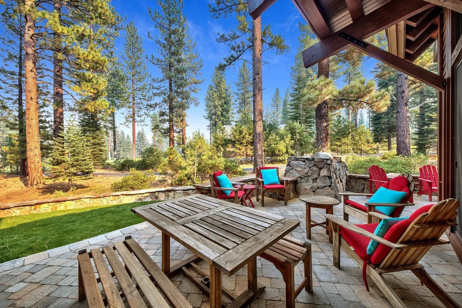 120 Bob Watson Truckee, CA 96161 - Photo 3 of 21 a view of a patio with table and chairs and couches with wooden floor and fence