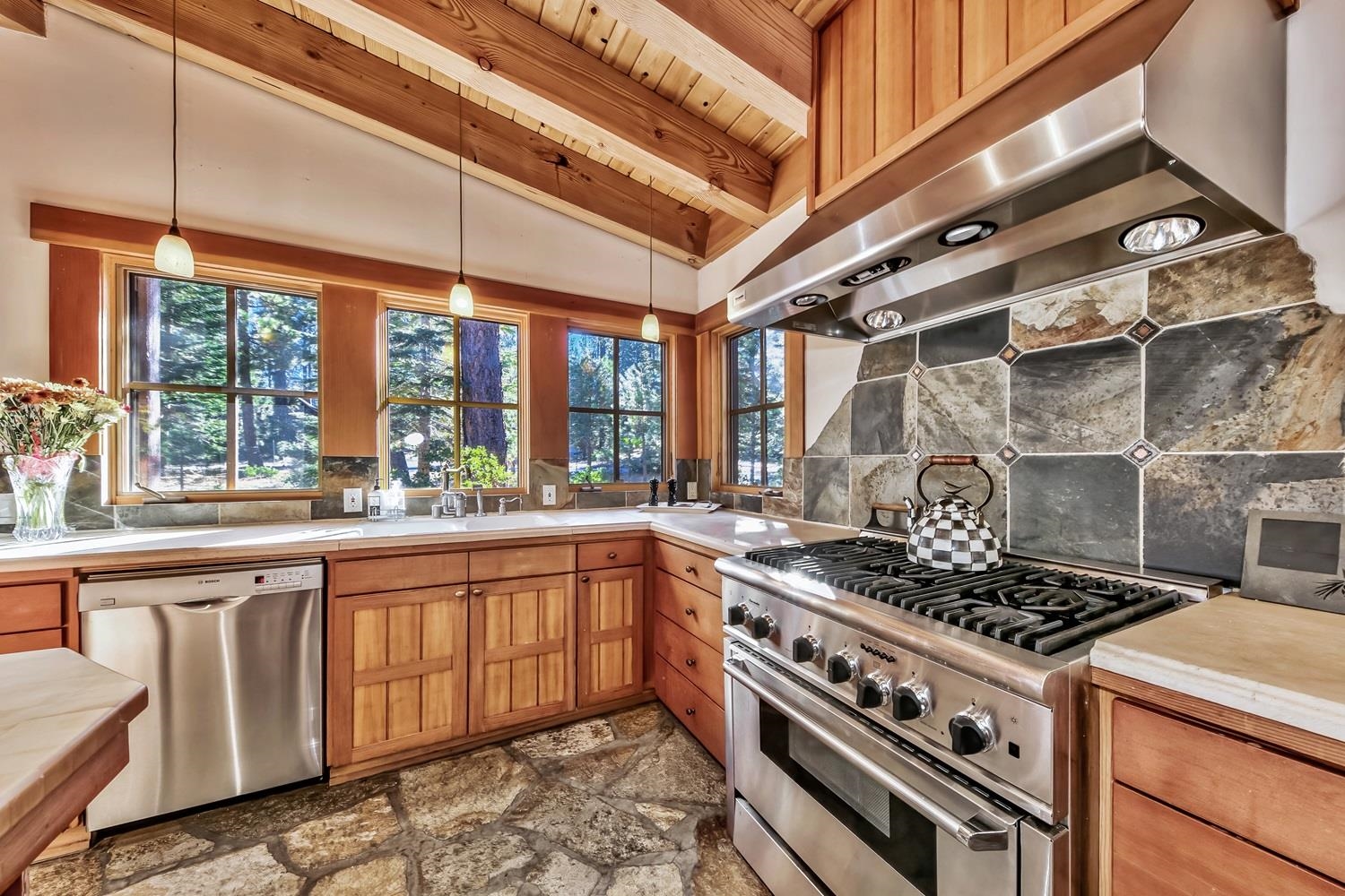 120 Bob Watson Truckee, CA 96161 - Photo 10 of 21 a kitchen with stainless steel appliances granite countertop a stove and a sink