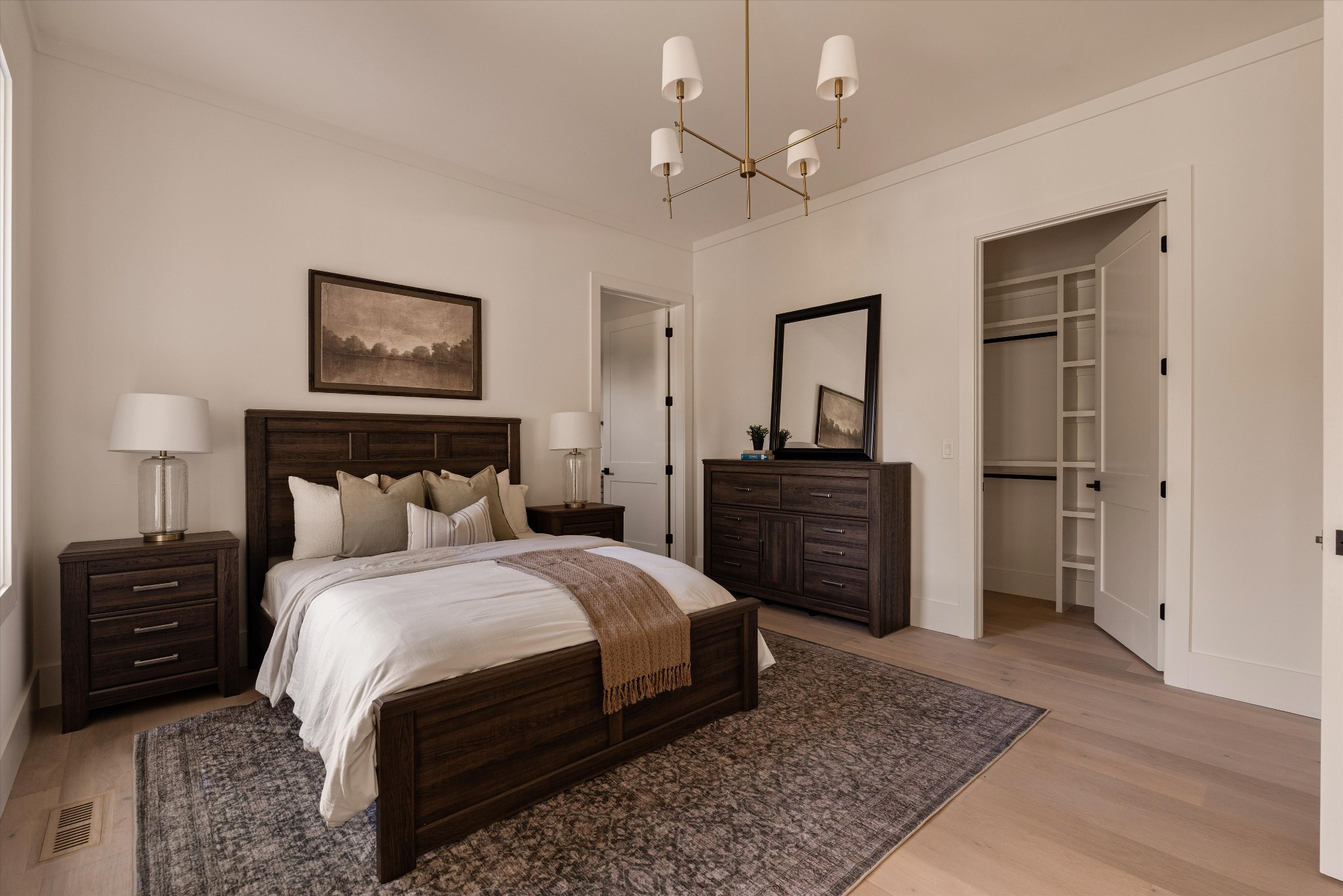 6801 Flat Creek Road College Grove, TN 37046 - Photo 45 of 66 a bedroom with a bed and a chandelier