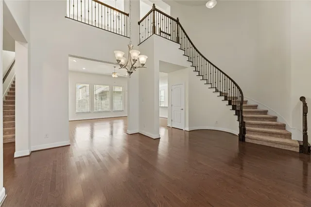 a view of an entryway with wooden floor