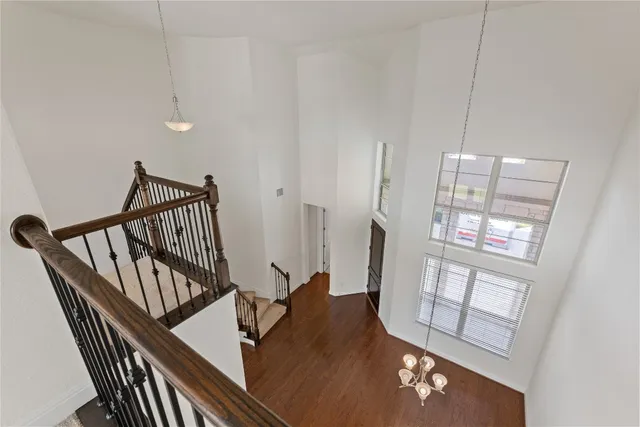 a view of an entryway with wooden floor