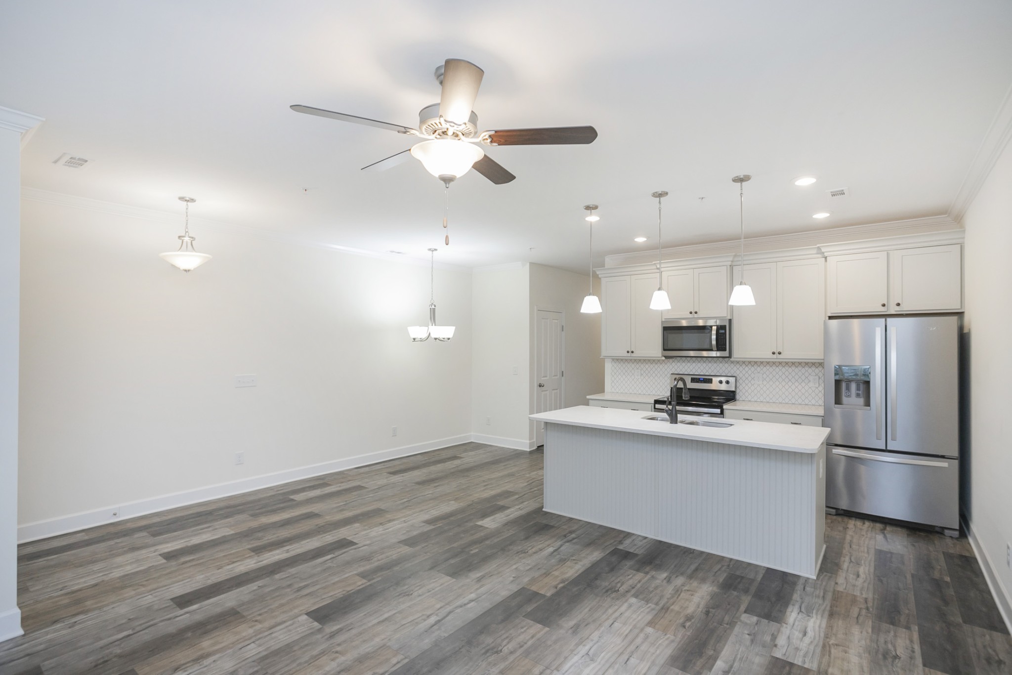 145 Mary Ann Circle Spring Hill, TN 37174 - Photo 13 of 36 a kitchen with stainless steel appliances a refrigerator and a stove top oven