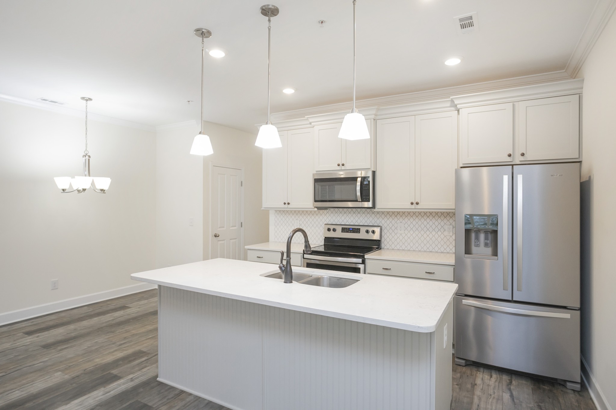 145 Mary Ann Circle Spring Hill, TN 37174 - Photo 14 of 36 a kitchen with stainless steel appliances a refrigerator sink and microwave