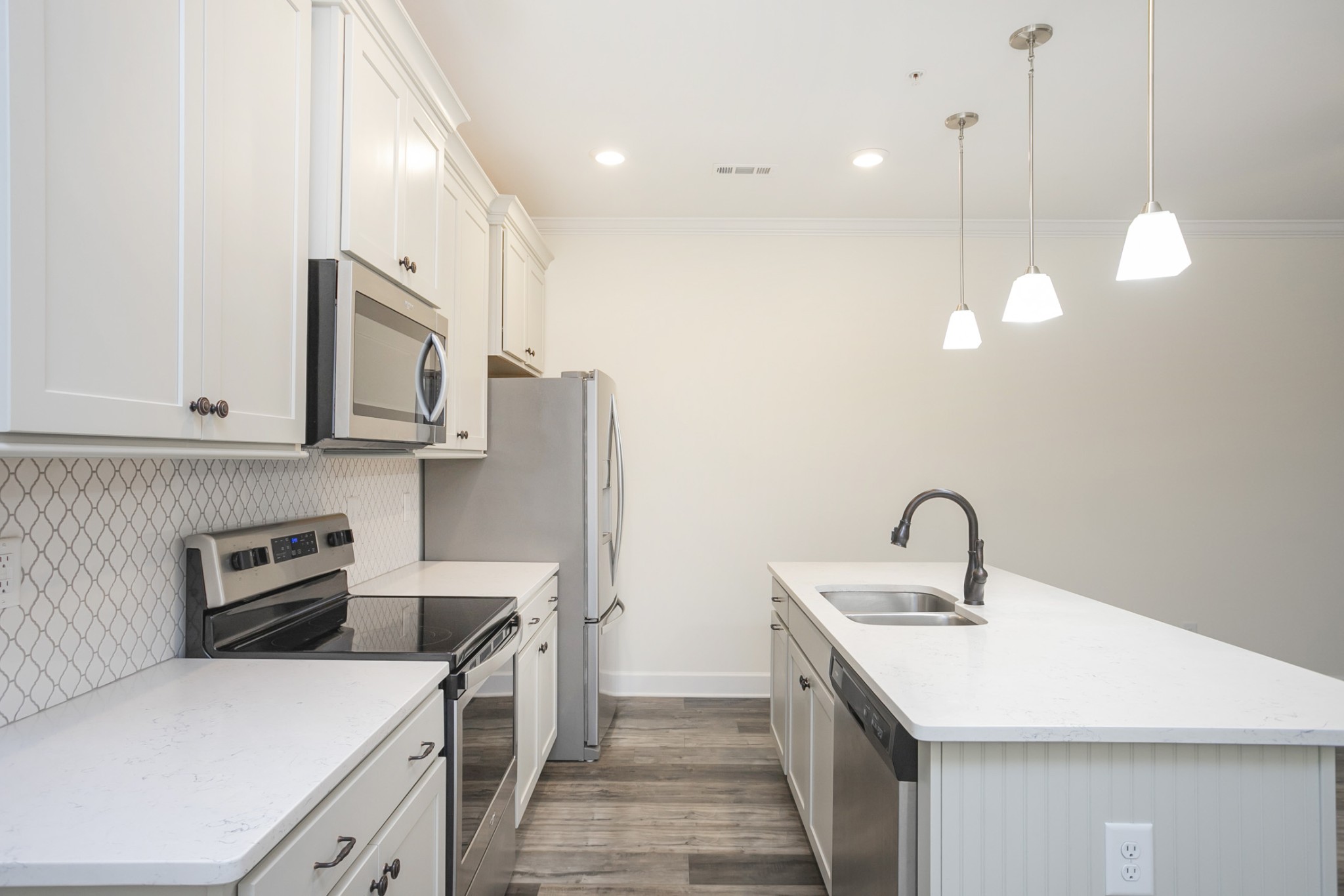 145 Mary Ann Circle Spring Hill, TN 37174 - Photo 16 of 36 a kitchen with a sink a stove and cabinets