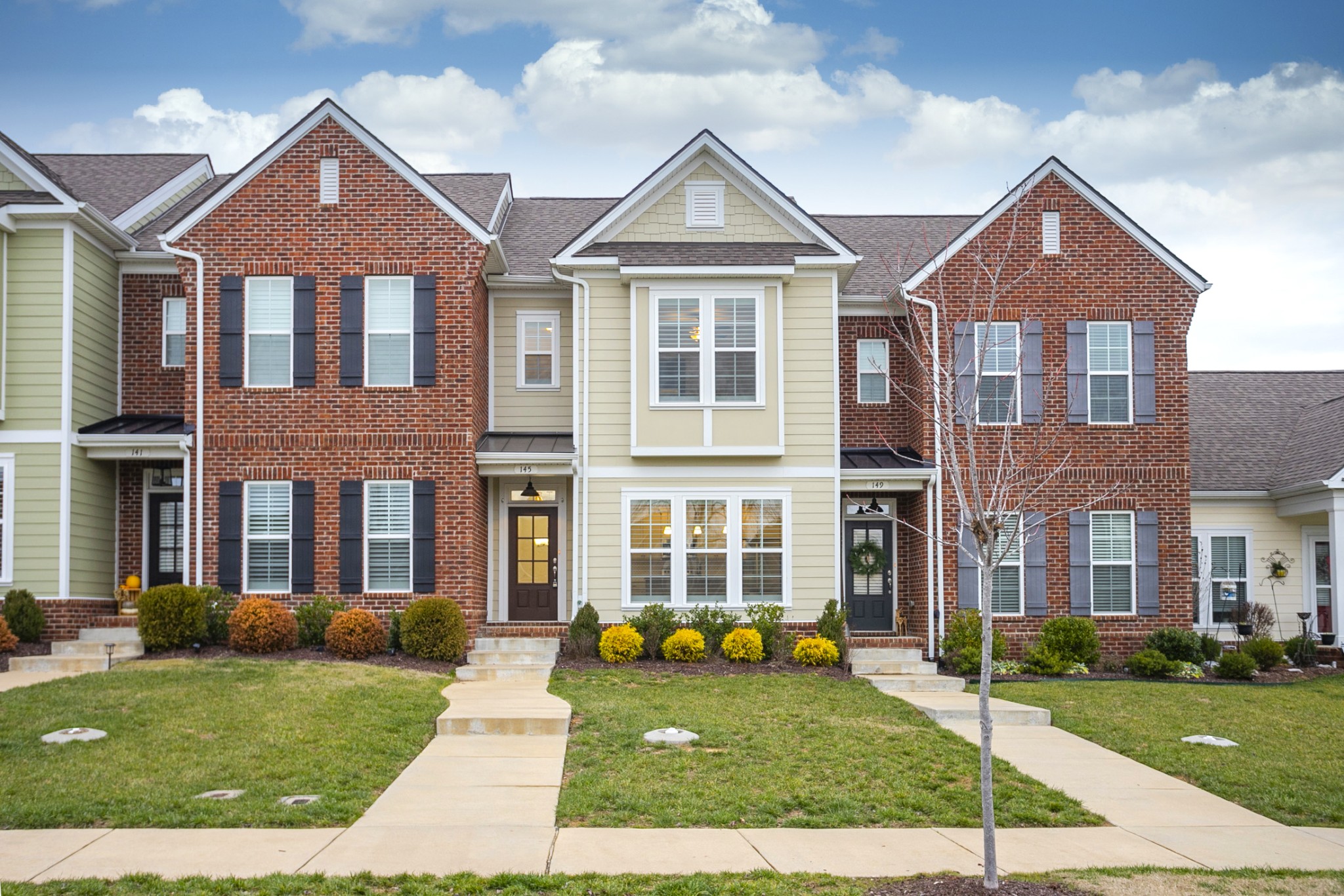 145 Mary Ann Circle Spring Hill, TN 37174 - Photo 2 of 36 front view of a brick house with a yard