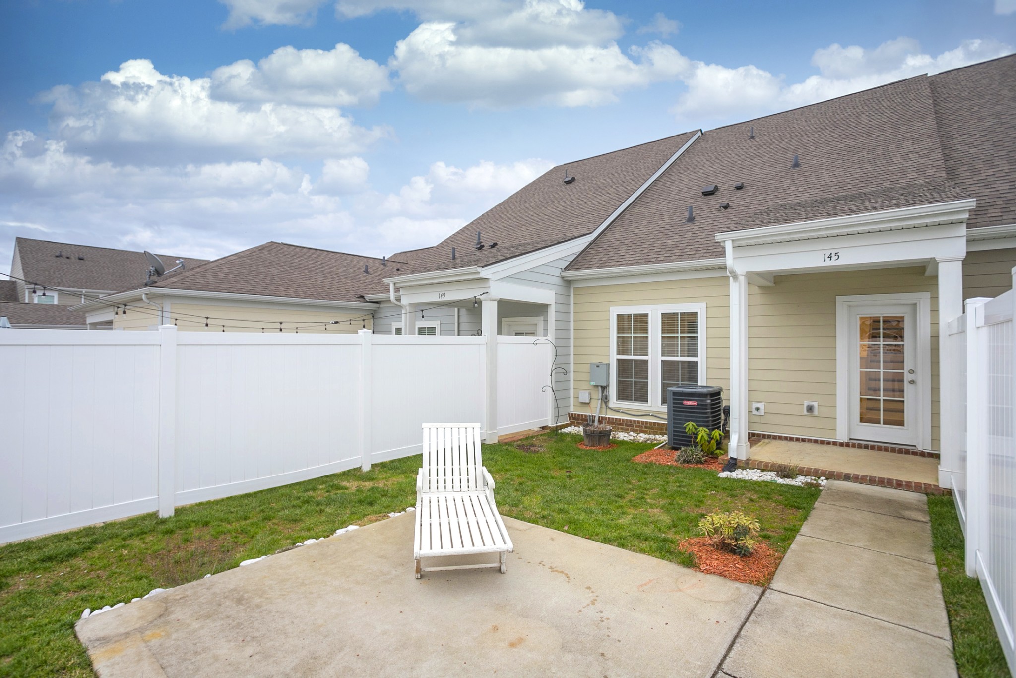 145 Mary Ann Circle Spring Hill, TN 37174 - Photo 25 of 36 a view of a house with backyard sitting area and garden