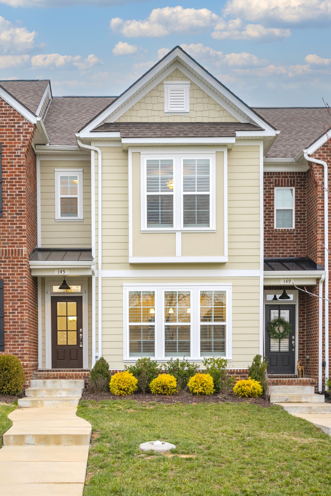 145 Mary Ann Circle Spring Hill, TN 37174 - Photo 3 of 36 a front view of a house with swimming pool and glass windows