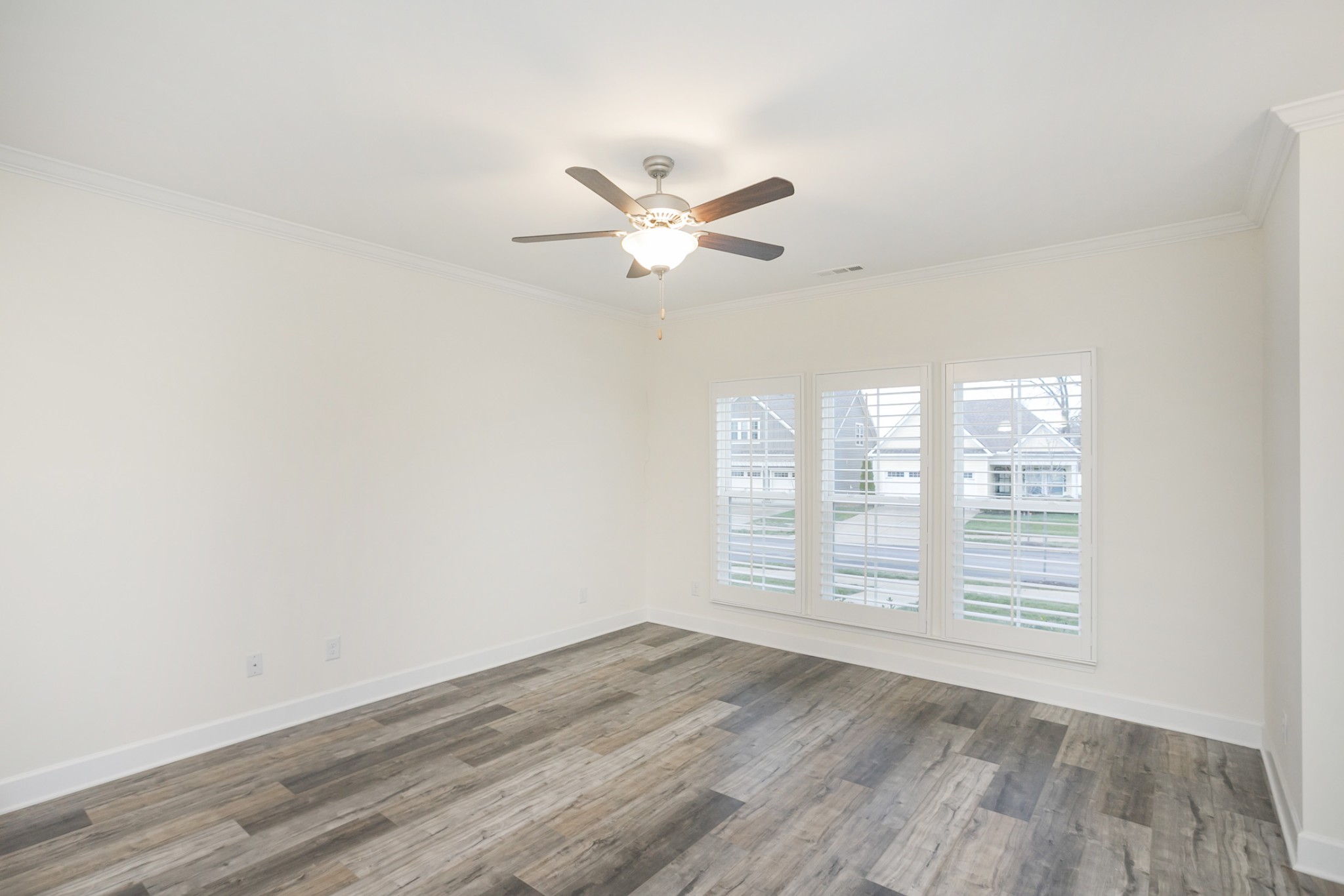 145 Mary Ann Circle Spring Hill, TN 37174 - Photo 8 of 36 wooden floor in an empty room with a window