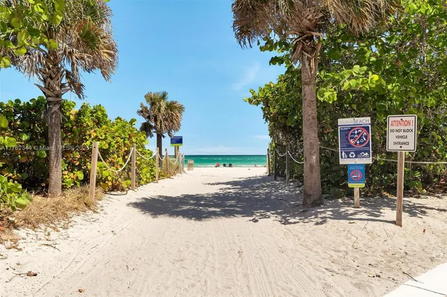 a view of street with tall buildings