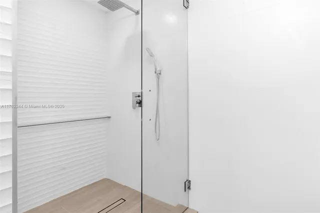 a bathroom with a granite countertop toilet and a sink