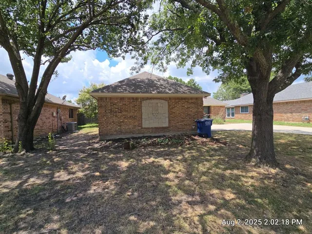 a view of a house with a tree