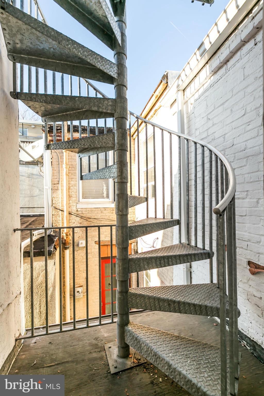 718 South Port Street Baltimore, MD 21224 - Photo 23 of 25 Spiral stairs to roof