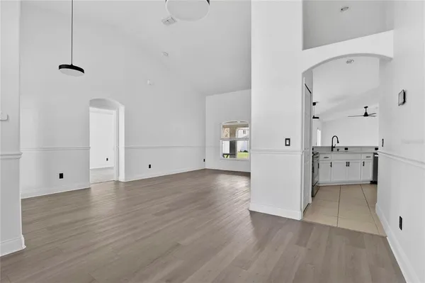 a kitchen with stainless steel appliances a refrigerator sink and cabinets