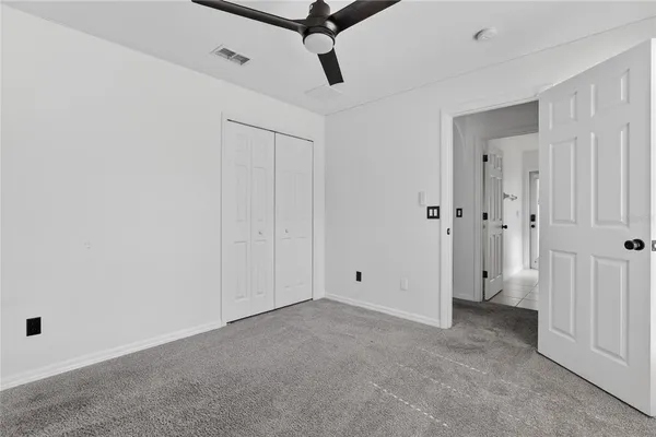 a view of empty room with windows