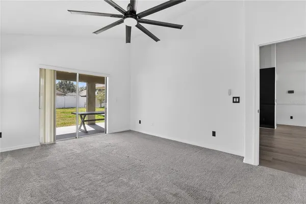 a bathroom with a granite countertop sink a toilet and a bathtub