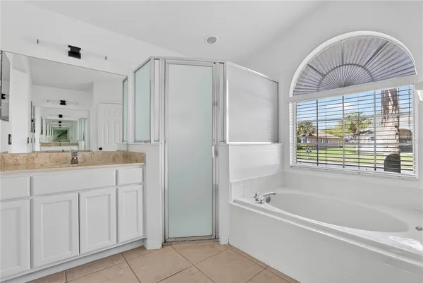 a view of a livingroom with furniture and windows