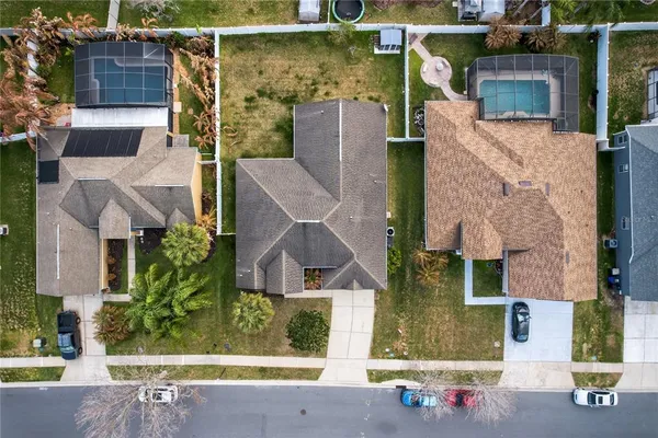 an aerial view of residential houses with outdoor space