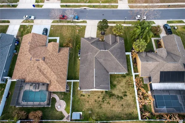 an aerial view of residential houses with city view