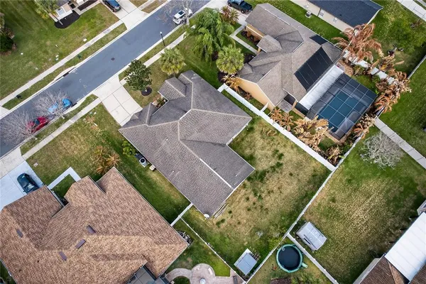 an aerial view of residential houses with city view