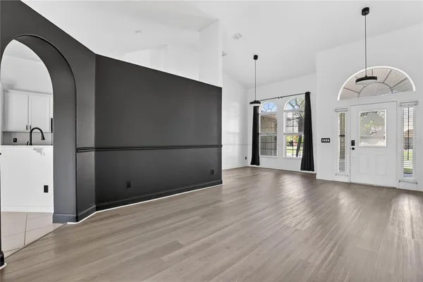 a kitchen with a sink stove and microwave