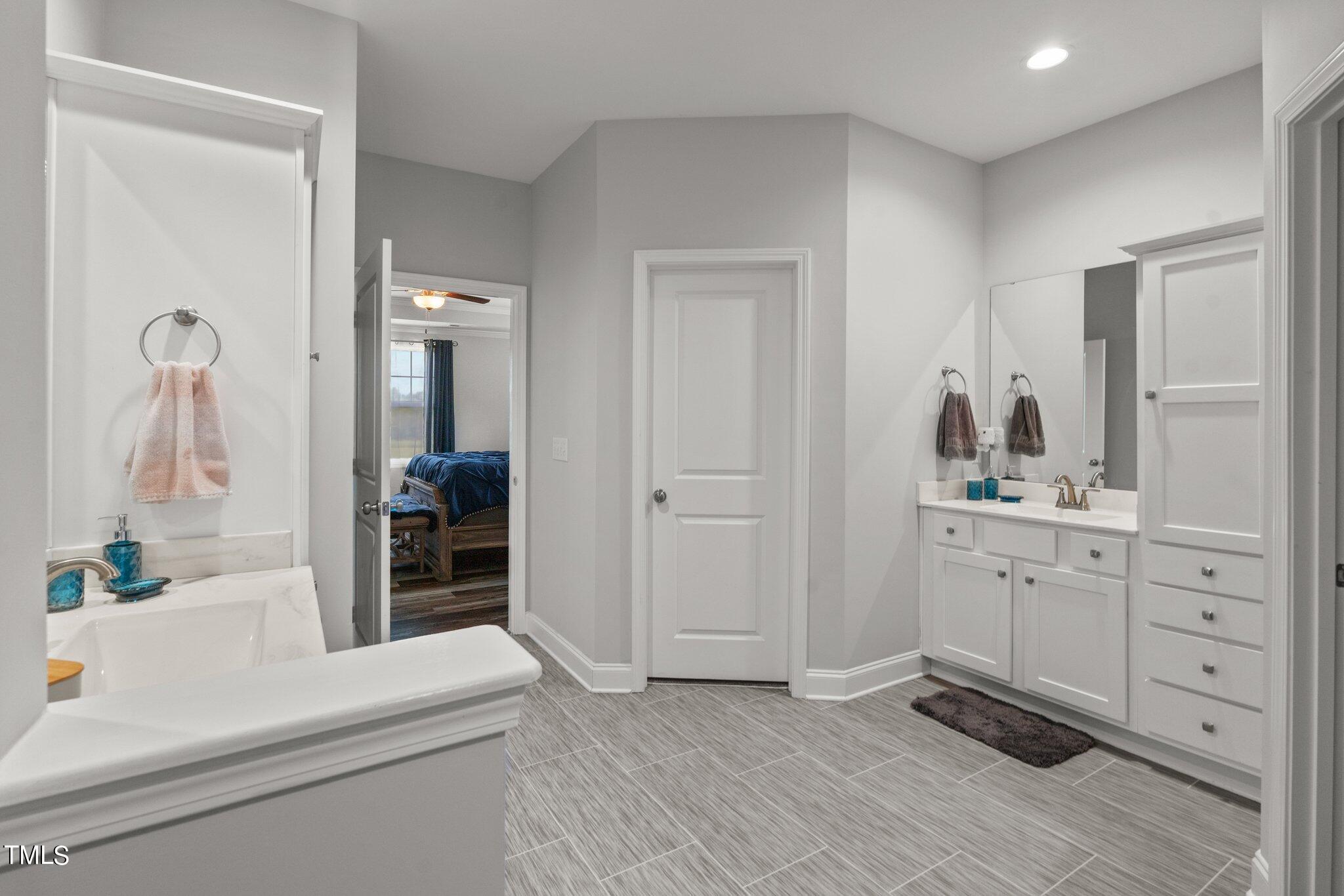 324 Spring Hill Church Road Lillington, NC 27546 - Photo 17 of 32 Primary bathroom - duel vanities and 2 walk in closets