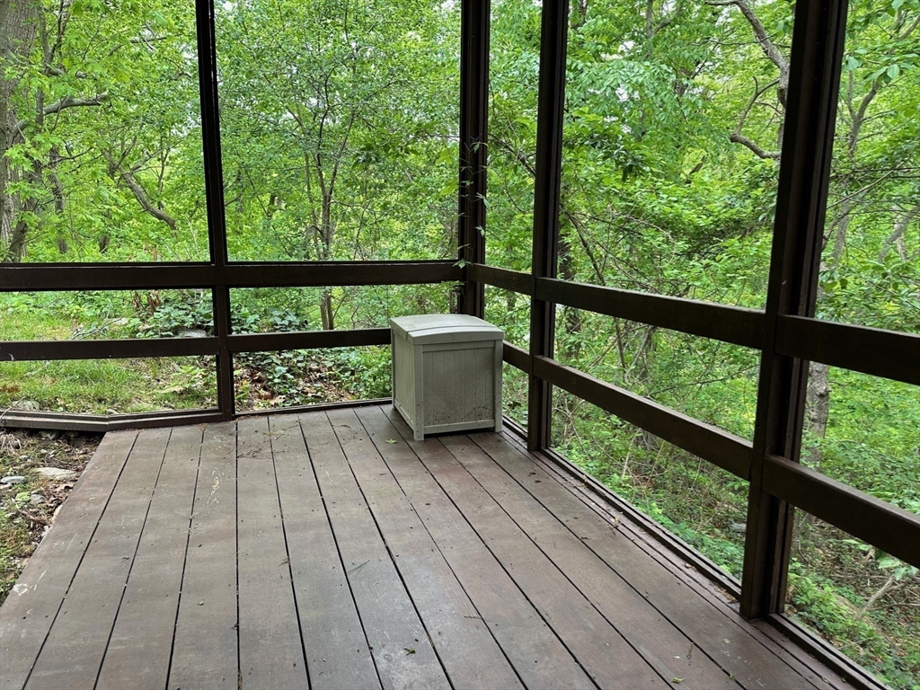 15 Curlew Street Boston, MA 02132 - Photo 21 of 30 a view of balcony with wooden floor