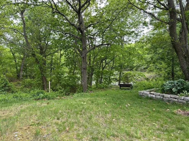a view of outdoor space with deck and yard
