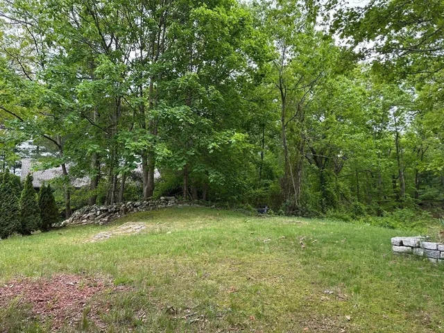 a view of outdoor space with deck and yard