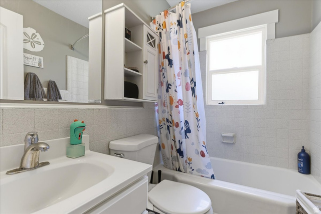 170 North 200 West Springville, UT 84663 - Photo 6 of 13 Bathroom featuring a single vanity, built-in medicine cabinet, and a combination tub and shower with white subway tile surround